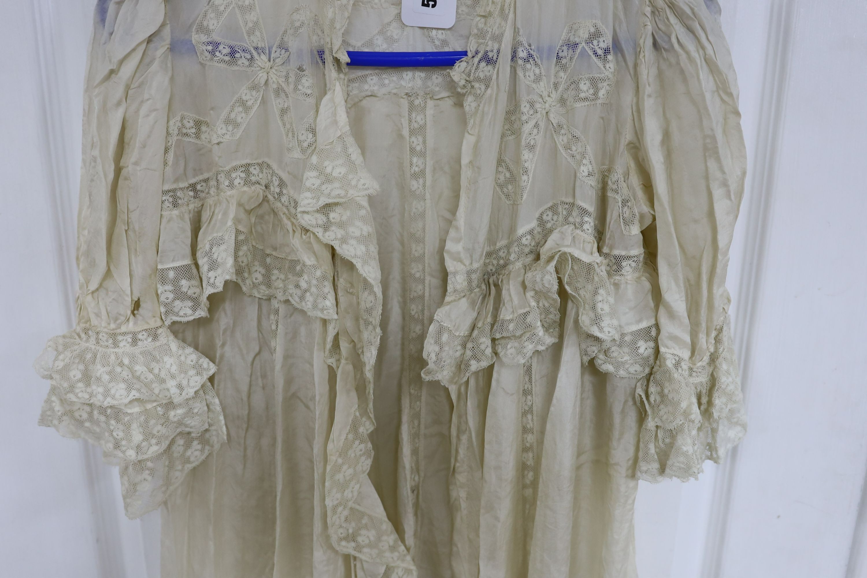 A fine cream silk and lace inserted lady's negligee